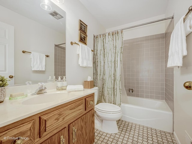 full bath with vanity, toilet, visible vents, and shower / tub combo