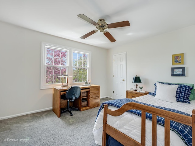 bedroom with baseboards, a ceiling fan, and light carpet