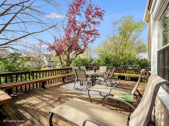 wooden deck with outdoor dining space