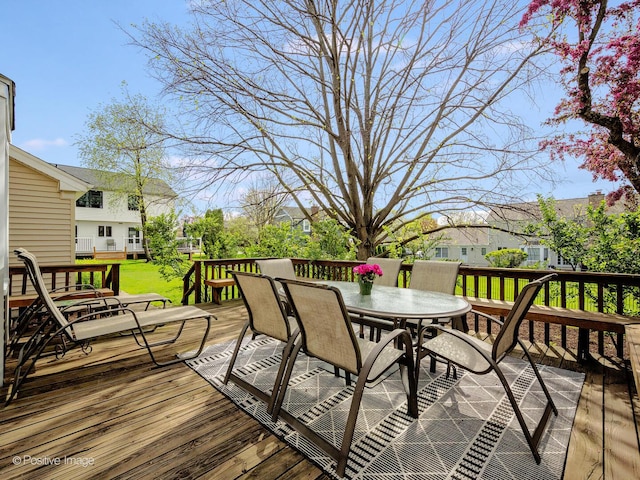 wooden terrace with outdoor dining space