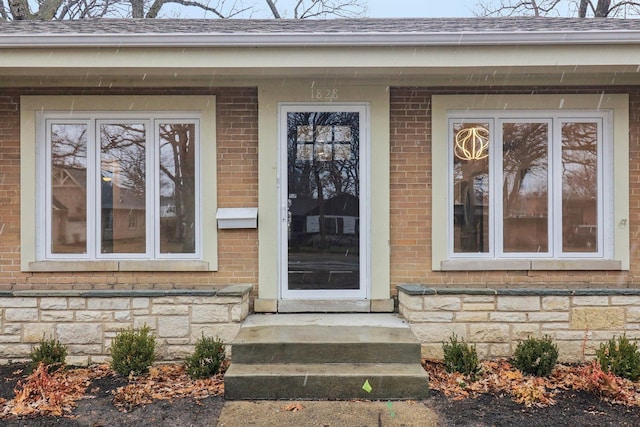 entrance to property with brick siding