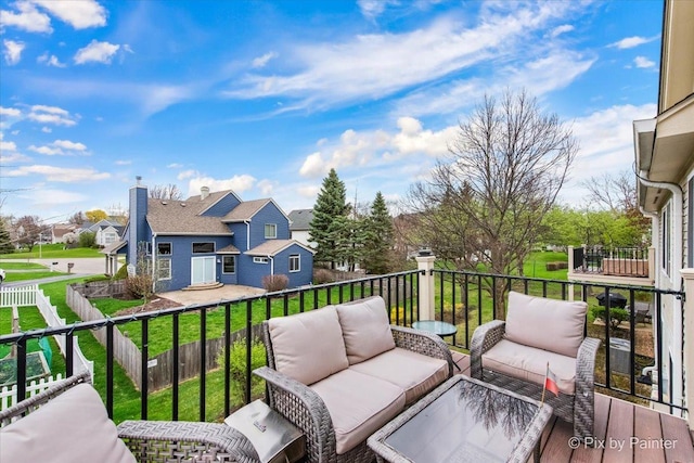 422 Cromwell Cir Unit 2, Bartlett, IL 60103 - wooden deck with an outdoor hangout area, a residential view, and a lawn