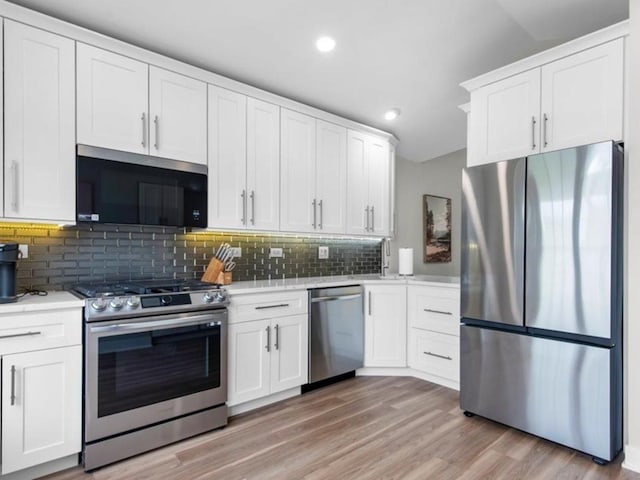422 Cromwell Cir Unit 2, Bartlett, IL 60103 - kitchen with appliances with stainless steel finishes, light countertops, backsplash, white cabinets, and recessed lighting