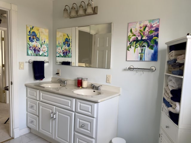 full bath featuring double vanity and a sink