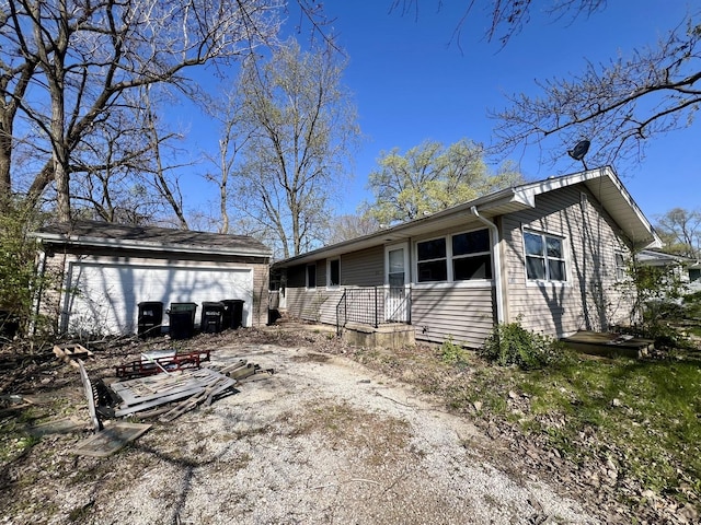 1011 N Coler Ave, Urbana, IL 61801 - view of front of home with an outdoor structure and a detached garage