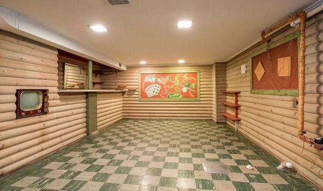 finished basement featuring recessed lighting, visible vents, and tile patterned floors