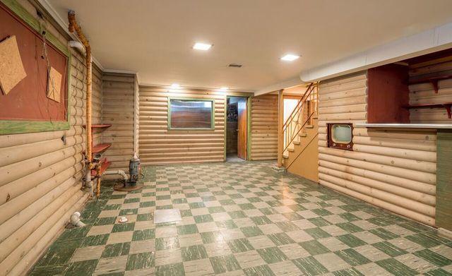 finished below grade area featuring stairway
