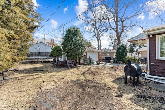 view of yard with a trampoline