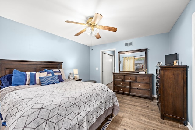 118 Circle Dr W, Montgomery, IL 60538 - bedroom with wood finished floors and ceiling fan