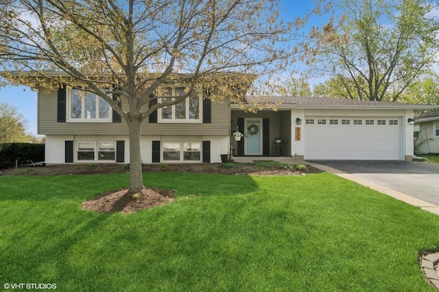 4175 Hudson Dr, Hoffman Estates, IL 60192 - view of front facade featuring an attached garage, driveway, and a front yard