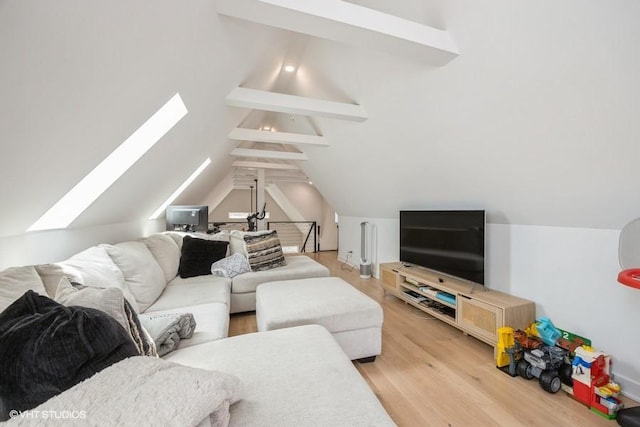 living room featuring lofted ceiling with skylight and light wood-type flooring
