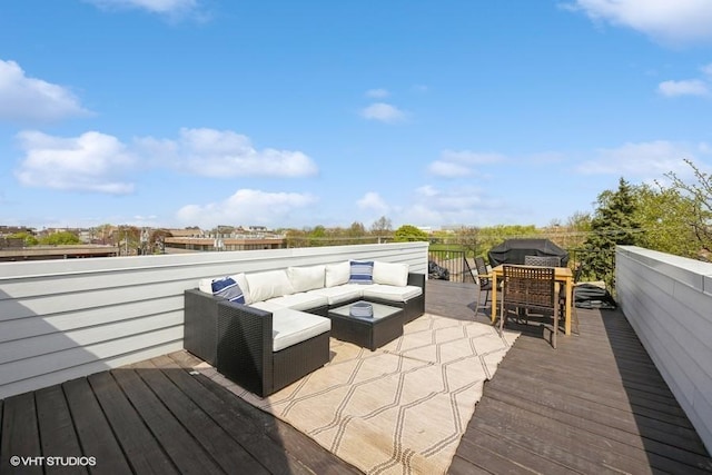 wooden deck featuring outdoor dining area and an outdoor living space