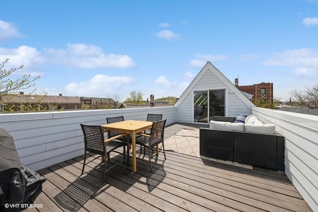 wooden terrace featuring outdoor dining space and an outdoor living space