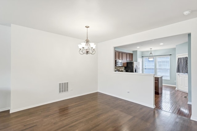 1122 Chelsea Dr, Lake Zurich, IL 60047 - empty room featuring dark wood-style flooring, visible vents, baseboards, a notable chandelier, and recessed lighting