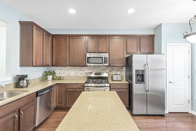 1122 Chelsea Dr, Lake Zurich, IL 60047 - kitchen featuring decorative backsplash, wood finished floors, a sink, stainless steel appliances, and recessed lighting