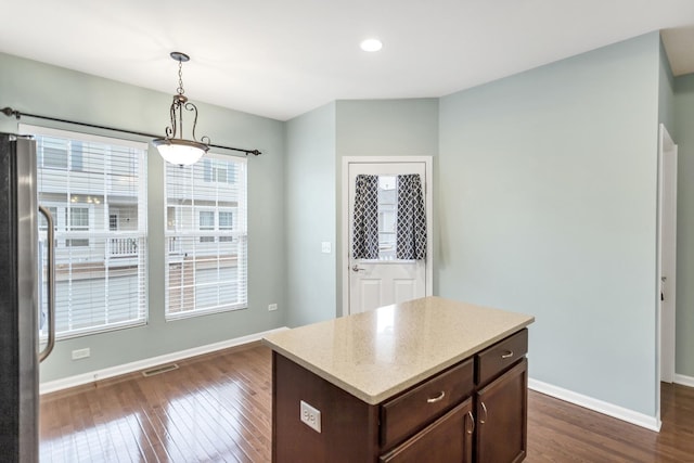 1122 Chelsea Dr, Lake Zurich, IL 60047 - kitchen featuring dark brown cabinetry, visible vents, baseboards, freestanding refrigerator, and dark wood-type flooring