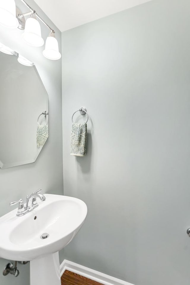 1122 Chelsea Dr, Lake Zurich, IL 60047 - bathroom with baseboards, a sink, and wood finished floors