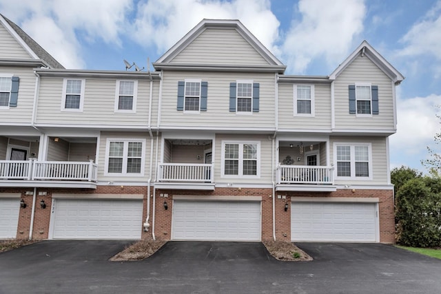 1122 Chelsea Dr, Lake Zurich, IL 60047 - multi unit property with brick siding, an attached garage, and driveway