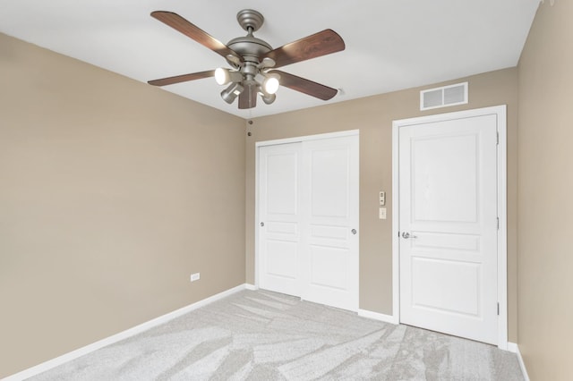 1122 Chelsea Dr, Lake Zurich, IL 60047 - unfurnished bedroom featuring ceiling fan, light colored carpet, visible vents, baseboards, and a closet