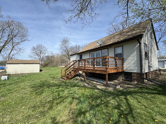 rear view of property featuring roof with shingles, a wooden deck, and a lawn