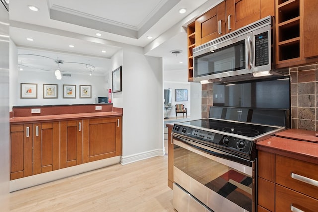 kitchen with brown cabinets, open shelves, tasteful backsplash, stainless steel appliances, and light wood-type flooring
