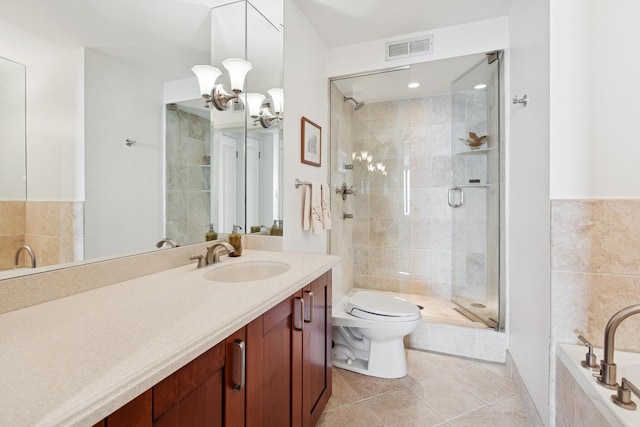bathroom with visible vents, vanity, toilet, tile patterned floors, and a shower stall
