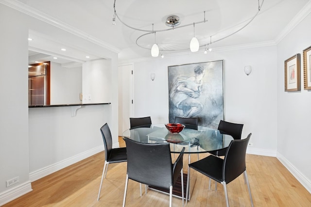 dining room with recessed lighting, baseboards, ornamental molding, and wood finished floors