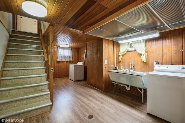 3809 N Sayre Ave, Chicago, IL 60634 - laundry area featuring wooden walls, independent washer and dryer, laundry area, and wood finished floors