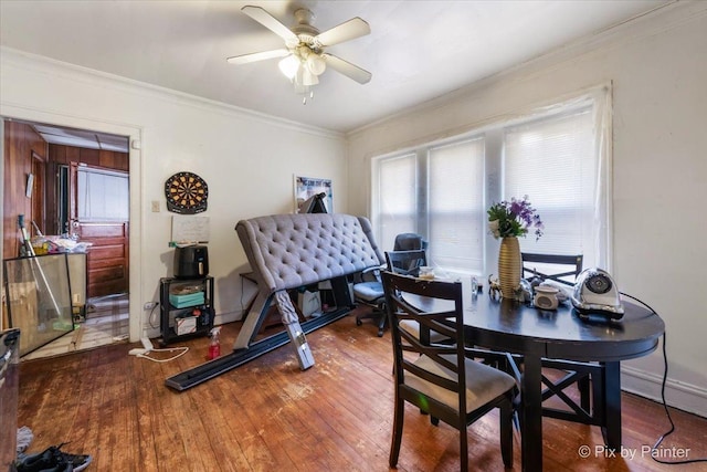 dining room featuring ornamental molding, ceiling fan, and wood-type flooring