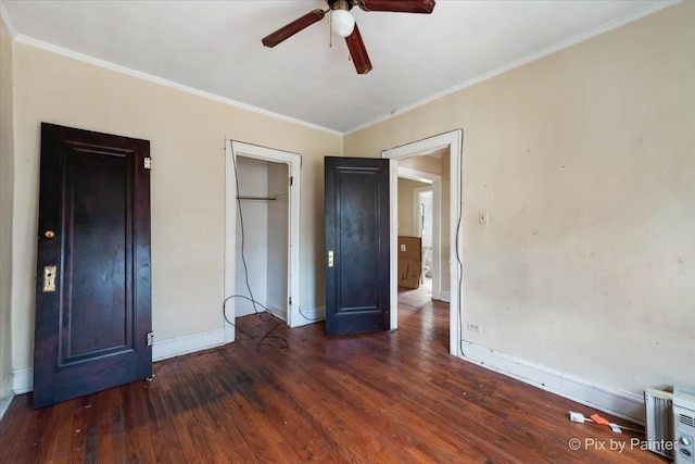 unfurnished bedroom featuring a ceiling fan, baseboards, crown molding, and wood finished floors