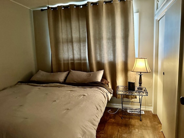 bedroom with wood finished floors