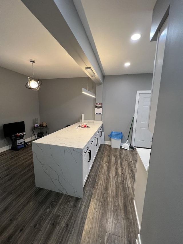 7435 S Indiana Ave, Chicago, IL 60619 - kitchen featuring dark wood finished floors, baseboards, white cabinetry, pendant lighting, and light stone countertops