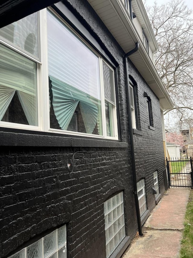 7435 S Indiana Ave, Chicago, IL 60619 - view of side of home with fence and brick siding