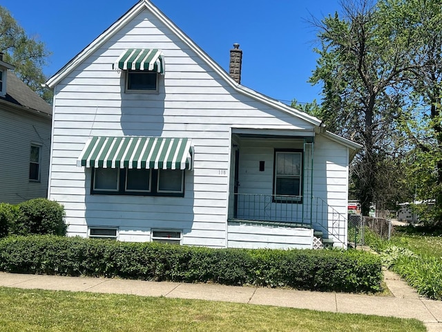 118 W 103rd Pl, Chicago, IL 60628 - view of side of property with a chimney