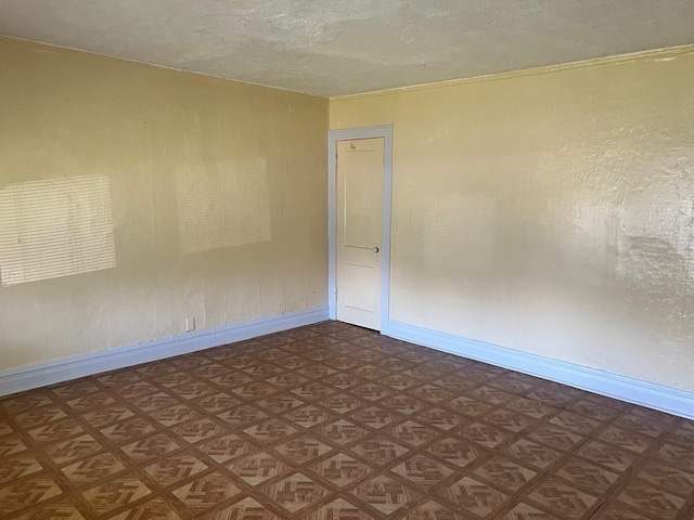 118 W 103rd Pl, Chicago, IL 60628 - empty room featuring baseboards and a textured ceiling