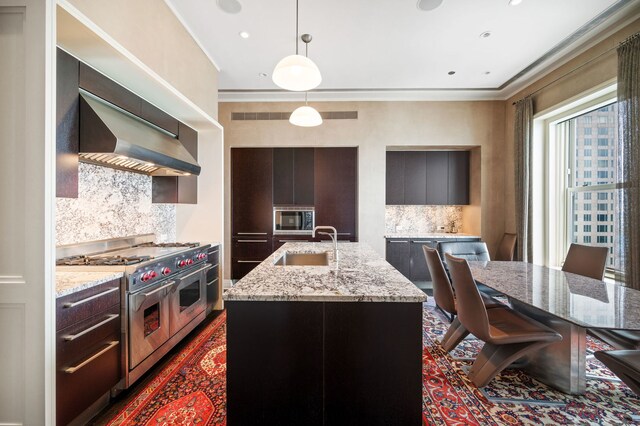 159 E Walton Pl Unit 34A, Chicago, IL 60611 - kitchen featuring a sink, built in microwave, double oven range, crown molding, and an island with sink