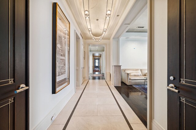 159 E Walton Pl Unit 34A, Chicago, IL 60611 - hallway featuring baseboards and light tile patterned flooring