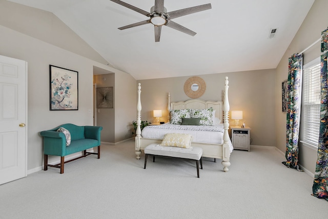 bedroom with ceiling fan, visible vents, vaulted ceiling, baseboards, and carpet