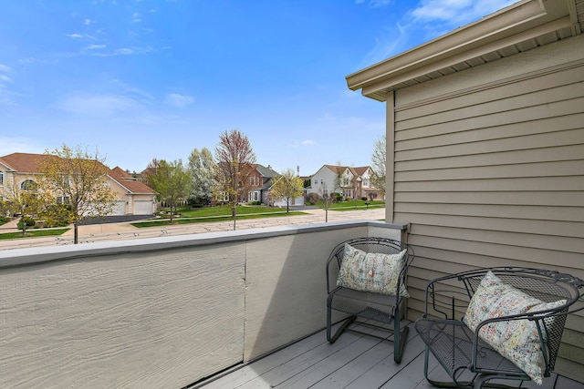 wooden deck featuring a residential view