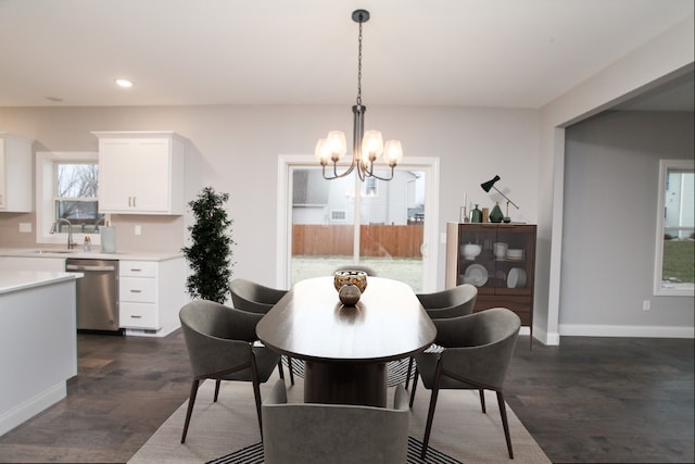 dining space featuring baseboards, recessed lighting, a chandelier, and dark wood finished floors