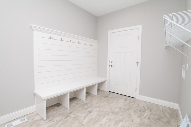 mudroom with baseboards and visible vents