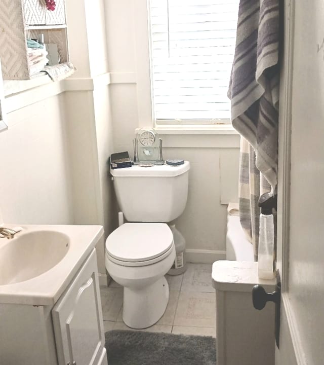 121 N Frolic Ave, Waukegan, IL 60085 - bathroom with vanity, tile patterned floors, baseboards, and toilet