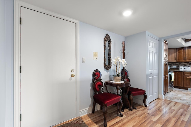 11138 Center Rd Unit E22, Palos Hills, IL 60465 - hall featuring light wood-style flooring and baseboards