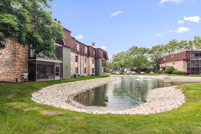 11138 Center Rd Unit E22, Palos Hills, IL 60465 - view of community featuring a yard and a water view