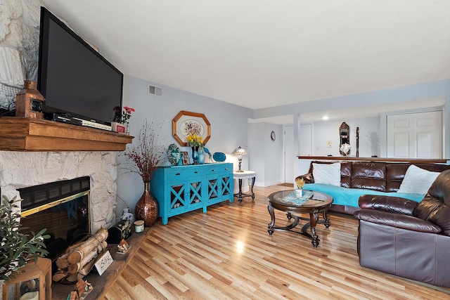 11138 Center Rd Unit E22, Palos Hills, IL 60465 - living room with wood finished floors and a fireplace
