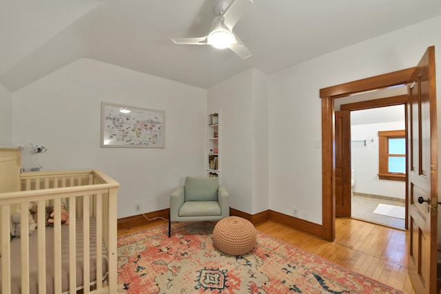 1726 Wesley Ave, Evanston, IL 60201 - bedroom featuring wood-type flooring, a crib, baseboards, and a ceiling fan