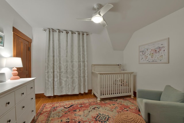 1726 Wesley Ave, Evanston, IL 60201 - bedroom featuring a nursery area, lofted ceiling, a ceiling fan, and light wood-style floors