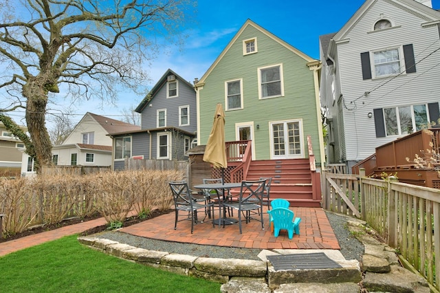 1726 Wesley Ave, Evanston, IL 60201 - rear view of house with a fenced backyard and a patio