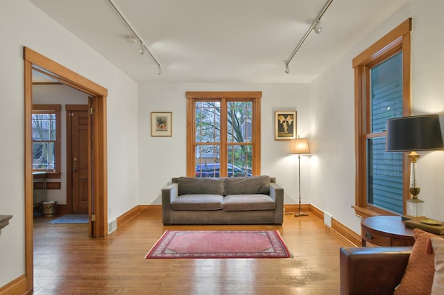 1726 Wesley Ave, Evanston, IL 60201 - living area with track lighting, baseboards, and wood finished floors