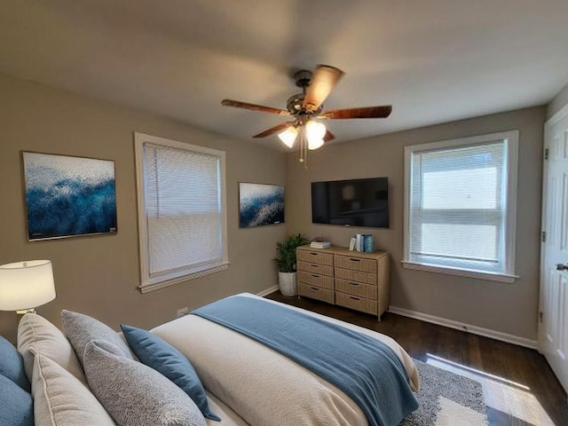 5133 W 64th St, Chicago, IL 60638 - bedroom featuring dark wood-type flooring, a ceiling fan, and baseboards